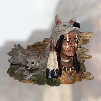 Front angled view showing shaman face, wolf headdress and two wolves