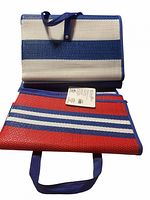 Mat unfolded showing stripe pattern and carry section