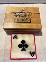 wooden box with logo and stitched coaster