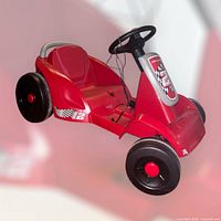 Full view of red Radio Flyer electric go-kart