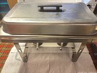 Closed chafer on folding frame, full view