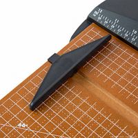 Top view of wood base with metric grid and adjustable paper guide of paper trimmer