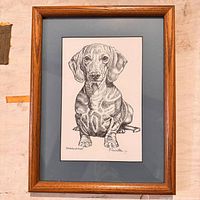 Front view of framed ink drawing showing image, mat and frame