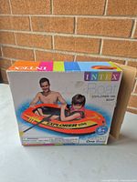 Front of sealed box showing Intex Explorer 100 boat image and branding
