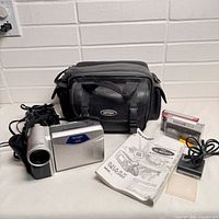 Camcorder, carry bag, tapes and accessories grouped