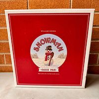 Front of original red box showing Williams-Sonoma Snowman Cake Pan artwork