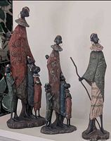 Four sculptures shown together to illustrate group composition and relative sizes