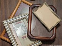 Four frames layered showing wood, silver beaded and octagonal designs