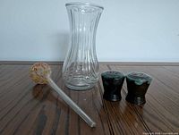 Lot overview showing vase, aqua globe, pair of shakers