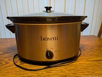 Front view of Bravetti slow cooker showing brand, control knob and cord