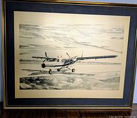Framed stipple artwork showing full view of aircraft scene
