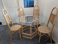 Table with glass top and four chairs