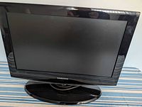 Front view of Samsung 19-inch LCD TV on stand