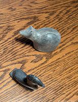Overhead view of both soapstone animal carvings