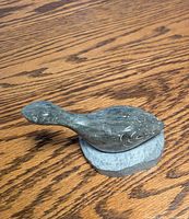 Overall view of soapstone bird on base