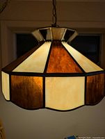 Overall view of stained glass lamp illuminated