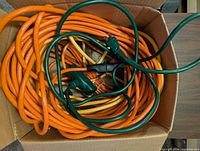 Box showing multiple coiled cords in orange, yellow and green