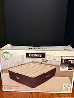 Front of box showing Bestway queen air mattress image and 20 in height icon