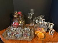 Overall lot showing glass jar, tealight set on tray, apothecary jar, stemmed votives, crystal cubes