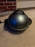 Grill with domed lid and power cord