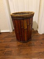 Full side view of cylindrical bamboo slat planter