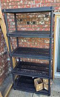 Front view of black plastic 5-shelf shelving unit