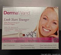 Front of retail box showing DermaWand branding and product image