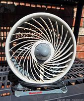 Front view showing spiral grille, size and dial