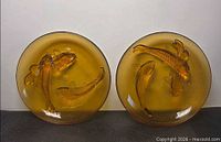 Both amber glass plates front view showing koi relief