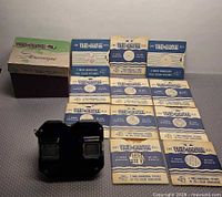 Viewer, box, and all twelve reels laid out