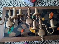 All three sconces top view showing design and finish