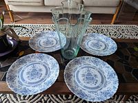 Group shot of four Arcopal plates and clear scalloped vase on table