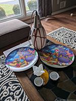 Full lot view showing both McDonald's plates, pendant light, candle holder, teacups