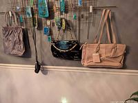 Wall view showing all four purses hanging