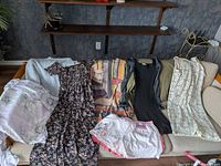 All garments laid out on sofa for overview