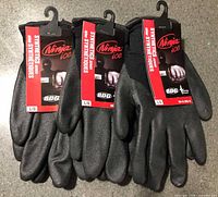 Three pairs of Ninja Ice gloves with tags displayed