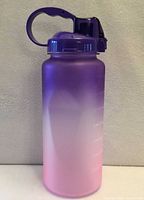 Full view of gradient purple-to-pink 64oz bottle