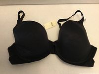 Front view of black Aerie full-coverage bra with tag visible
