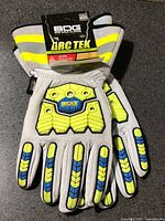 Front view showing BDG Arc Tek gloves with tags and impact guards
