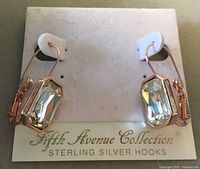 Front view of pair of Swarovski crystal earrings on Fifth Avenue Collection card