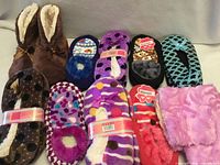 All ten pairs of assorted slippers displayed together