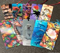 All ten laminated bookmarks laid out showing front designs and tassels