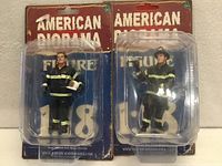 Front view of both American Diorama 1:18 firefighter figures in sealed blister packaging