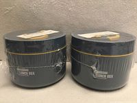 Front view of both sealed blue insulated lunch containers