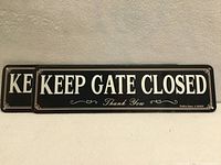 Front view of both identical signs showing "KEEP GATE CLOSED Thank You" text and decorative border