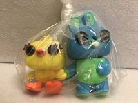 Ducky and Bunny figures wrapped together in plastic