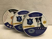 Front view of three tins showing product name and graphics