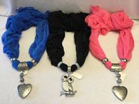 Blue, black, and pink sheer scarf necklaces with silver-tone tube beads and pendants displayed side by side