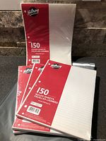 Front view of three sealed Hilroy paper packs upright and one flat