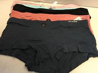 Stack showing five underwear pairs with visible La Vie en Rose tag